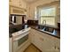 Functional kitchen with white cabinetry, tile accents, and a convenient layout at 3437 Wilkesboro Hwy, Statesville, NC 28625