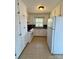 Functional kitchen featuring white cabinetry, ample storage, and modern appliances at 3437 Wilkesboro Hwy, Statesville, NC 28625