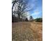 View of the land showing potential and beautiful blue sky, with trees in the background at 3437 Wilkesboro Hwy, Statesville, NC 28625