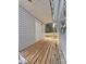 Home's side porch features wood floors with a covered ceiling, offering access to a backyard at 3437 Wilkesboro Hwy, Statesville, NC 28625