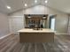 Modern kitchen featuring a granite island, stainless steel appliances, and pendant lighting at 3537 Taxahaw Rd, Lancaster, SC 29720