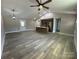 Open-concept living room and kitchen area with vaulted ceilings and luxury vinyl plank flooring at 3537 Taxahaw Rd, Lancaster, SC 29720