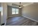 Bright bedroom with tray ceiling, ceiling fan, luxury vinyl plank flooring and large window at 3537 Taxahaw Rd, Lancaster, SC 29720