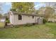 Well-maintained backyard with a storage shed and mature trees at 3660 Fieldcrest Nw Cir, Concord, NC 28027