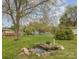 Picturesque backyard featuring a serene pond and lush greenery at 3660 Fieldcrest Nw Cir, Concord, NC 28027