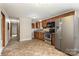 Well-equipped kitchen with stainless appliances and tiled floors at 3660 Fieldcrest Nw Cir, Concord, NC 28027