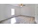 Bedroom features ceiling fan, ample natural light, and LVP flooring at 405 Aquadale Rd, Albemarle, NC 28001
