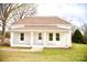 Inviting single-story home with classic white brick and a covered front porch at 405 Aquadale Rd, Albemarle, NC 28001