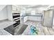 Modern kitchen boasting stainless appliances, custom cabinets, and stylish granite countertops at 405 Aquadale Rd, Albemarle, NC 28001