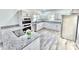 Bright kitchen features stainless steel appliances, granite countertops, and ample cabinet space at 405 Aquadale Rd, Albemarle, NC 28001