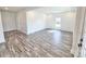 Spacious living room with LVP flooring and natural light at 405 Aquadale Rd, Albemarle, NC 28001