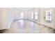 Living room featuring lots of natural light and LVP flooring at 405 Aquadale Rd, Albemarle, NC 28001