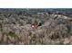 An aerial perspective of a home situated among lush trees, near other residences and green spaces at 423 Bethel Dr, Salisbury, NC 28144