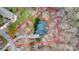 Aerial view of property lines that outline a home nestled in a wooded area with mature landscaping at 423 Bethel Dr, Salisbury, NC 28144