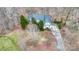 Beautiful aerial view of a home with a long drive, mature trees, and a well-manicured lawn at 423 Bethel Dr, Salisbury, NC 28144