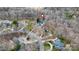 An aerial view of a home located in a quiet neighborhood with winding roads and mature trees at 423 Bethel Dr, Salisbury, NC 28144