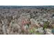 This aerial view highlights the home's location among mature trees in a private, wooded setting at 423 Bethel Dr, Salisbury, NC 28144