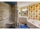This bathroom features a glass shower with a seat, floral wallpaper, and a white vanity and jacuzzi tub at 423 Bethel Dr, Salisbury, NC 28144