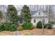 Charming home exterior with mature trees, manicured landscaping, and a welcoming front entrance at 423 Bethel Dr, Salisbury, NC 28144