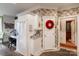 Hallway featuring floral wallpaper, access to different areas, and access to a desk/office space at 423 Bethel Dr, Salisbury, NC 28144