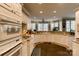 Bright kitchen with white cabinets, tile floors, and stainless steel appliances offers a functional and stylish space at 423 Bethel Dr, Salisbury, NC 28144