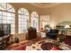 Bright living room featuring large windows, hardwood floors, a cozy seating area, and a view of the deck at 423 Bethel Dr, Salisbury, NC 28144