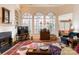 Spacious living room with large windows, fireplace, and a decorative rug at 423 Bethel Dr, Salisbury, NC 28144
