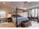 Luxurious bedroom with a canopy bed, neutral colors, and large windows provides a calming and comfortable atmosphere at 423 Bethel Dr, Salisbury, NC 28144