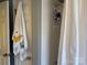 Bright bathroom features a tiled shower with storage rack and a towel with ducky and frog accents at 511 Glencurry Dr, Charlotte, NC 28214