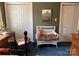 Cozy bedroom featuring a woven bench, dark green walls, and closet at 511 Glencurry Dr, Charlotte, NC 28214