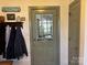 A back door with nine panes of glass and a coat rack at 511 Glencurry Dr, Charlotte, NC 28214
