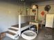 View of a garage with painted walls, a staircase, and storage shelves at 511 Glencurry Dr, Charlotte, NC 28214