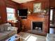 Cozy living room featuring a fireplace and built-in wooden cabinetry, perfect for relaxation at 511 Glencurry Dr, Charlotte, NC 28214