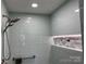 Modern tile shower with rainfall showerhead and a built-in shelf at 511 Glencurry Dr, Charlotte, NC 28214