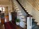 Elegant staircase with wainscoting and a view into the adjacent kitchen at 511 Glencurry Dr, Charlotte, NC 28214