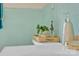 Classic bathroom featuring teal ceramic tile, a floating shelf, and vintage accents at 6231 Nc 16 N Hwy, Taylorsville, NC 28681