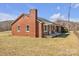 Brick home with covered porch and a spacious yard perfect for outdoor activities and relaxation at 6231 Nc 16 N Hwy, Taylorsville, NC 28681