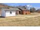 Brick home with a detached white garage, offering a spacious backyard at 6231 Nc 16 N Hwy, Taylorsville, NC 28681
