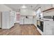 Functional kitchen with white cabinets, modern appliances, and direct access to the outside at 6231 Nc 16 N Hwy, Taylorsville, NC 28681