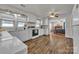 Bright kitchen featuring white cabinets, updated appliances, and seamless flow to living area at 6231 Nc 16 N Hwy, Taylorsville, NC 28681