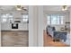 Open concept: kitchen view into the living room; updated floors and abundant light at 6231 Nc 16 N Hwy, Taylorsville, NC 28681