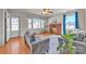 Inviting living room featuring a decorative fireplace, gray sofas, and wood flooring at 6231 Nc 16 N Hwy, Taylorsville, NC 28681