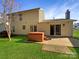 Backyard featuring a hot tub and patio area perfect for outdoor relaxation at 6606 Antrim Ct, Charlotte, NC 28217