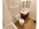 Cozy bathroom with a combined tub and shower unit, tile floor, and vanity with storage at 6606 Antrim Ct, Charlotte, NC 28217