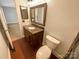 A charming bathroom with a framed mirror and granite countertop at 6606 Antrim Ct, Charlotte, NC 28217