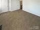 Bright bedroom with a large closet and access to a hallway at 6606 Antrim Ct, Charlotte, NC 28217