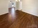 Open entryway that connects living areas, with hardwood flooring and neutral wall paint at 6606 Antrim Ct, Charlotte, NC 28217