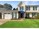 Charming two-story home featuring blue shutters, a manicured lawn, and a two-car garage at 6606 Antrim Ct, Charlotte, NC 28217