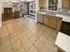 Updated kitchen with tile flooring, modern appliances, and lots of counter space at 6606 Antrim Ct, Charlotte, NC 28217