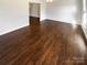 Spacious living room with hardwood floors and an open floor plan at 6606 Antrim Ct, Charlotte, NC 28217